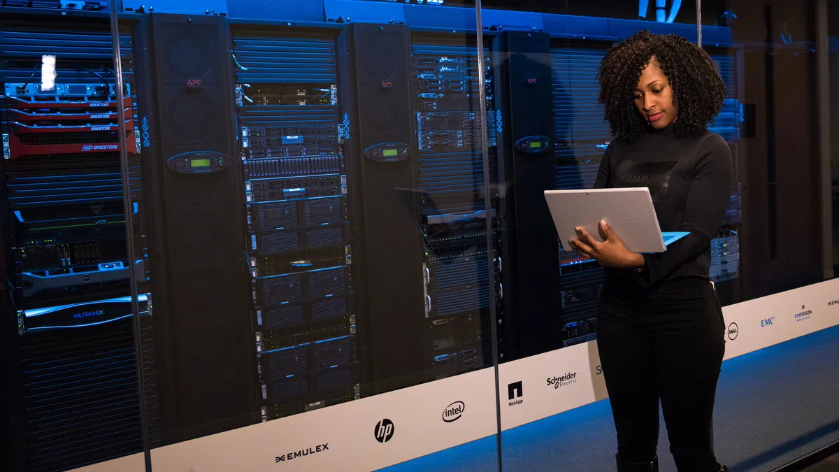 A technology professional reviewing modern data-centre infrastructure